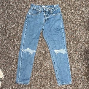 cute light washed pair of ripped mom jeans